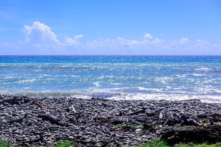 Seascape with stones and blue sky in Okinawa, Japan.の写真素材