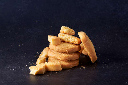 A pile of cookies on a black background