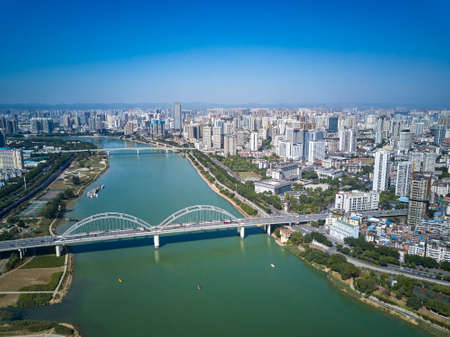 High-rise residential area along the river and bridge across the river in the cityのeditorial素材
