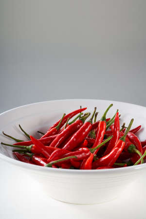 A bowl of flaming red millet pepper close-upの写真素材