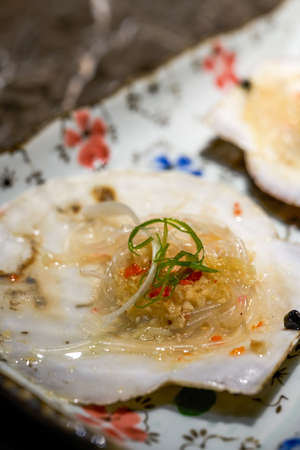 A delicious Japanese dish, raw grilled scallops