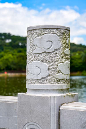 Chinese style bridge pillar auspicious cloud stone carving close-up