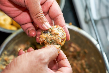 A chef is making China's Guangxi traditional dish, fried tofu stuffed with meatの写真素材