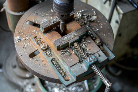 Close-up of platform of industrial small metal cutting milling machine