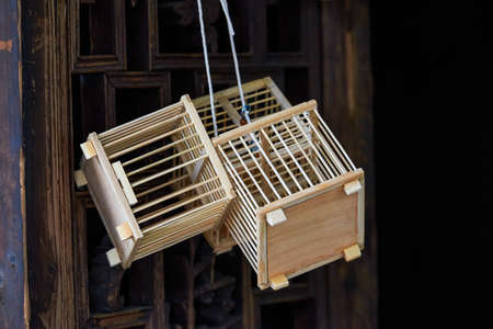 Close-up of several wooden bird cagesの写真素材
