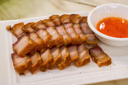 A crispy and delicious Chinese traditional Cantonese dish with crispy skin and pork bellyの写真素材