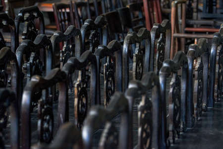 Close up of rows of mahogany stools for sale in mahogany furniture storeの写真素材