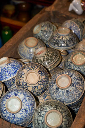 Pile of ceramic rice bowls and tea bowls close-upの写真素材