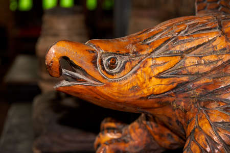 Close-up of a wood-carved eagle headのeditorial素材