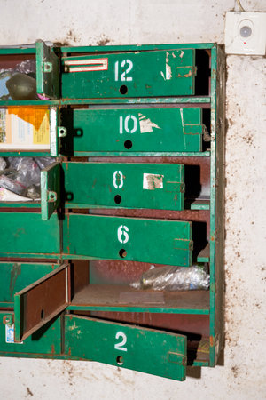 Old green metal mailbox cabinet