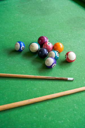 Billiards and pool cues on the pool tableの写真素材
