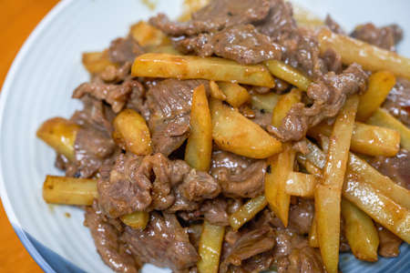 A delicious home-cooked dish, fried beef with potatoes
