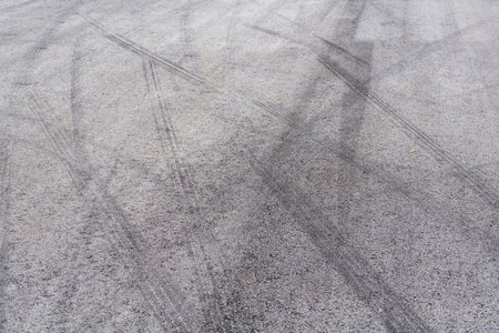 Car tire slamming marks on asphalt roadの写真素材