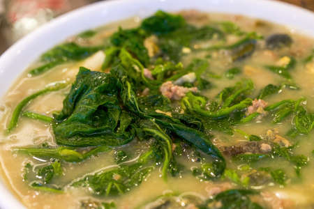 A delicious Chinese dish with wild vegetables in soup