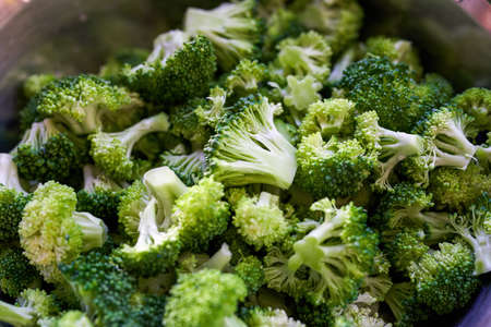Bunch of chopped raw broccoli close-up
