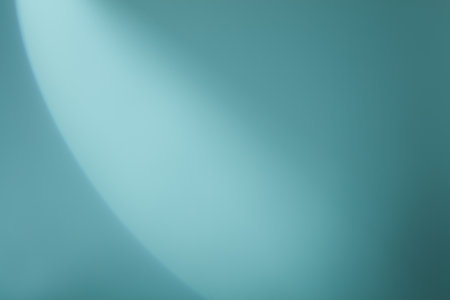 A semicircle of lights hits a green backgroundの写真素材