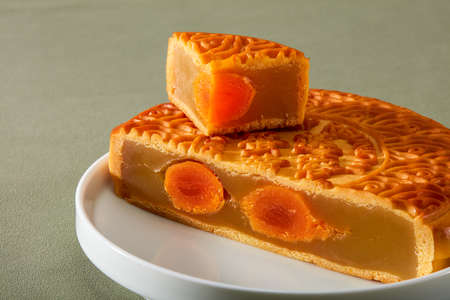 Cantonese-style traditional egg yolk lotus paste mooncake for Chinese Mid-Autumn Festival, translation: egg yolk lotus paste.の写真素材