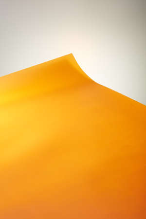 A dining table with orange background paperの写真素材