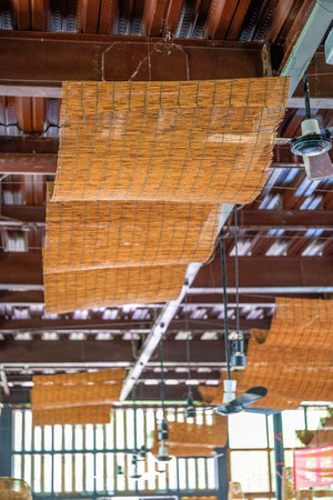 Ceiling decorated with bamboo mats in farmhouse restaurantの写真素材