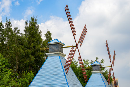 Closeup of wooden house windmill in the park