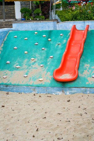 Play sand pool and slides in children's playgroundの写真素材