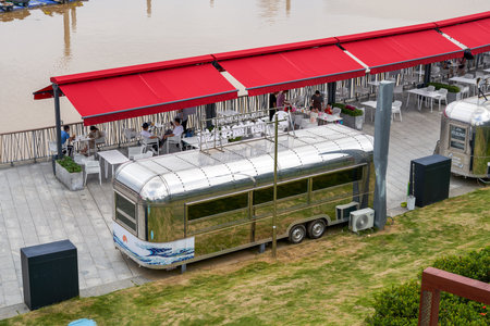 Close-up of metal mobile food truck in the parkの写真素材