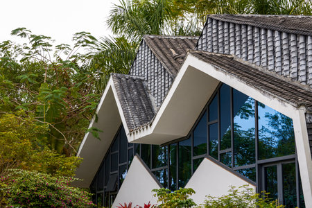 An angular modern building in a forest