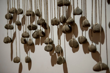 Close-up of a sculpture composed of a pile of stones and pebbles indoorsの写真素材
