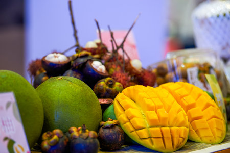 Pile of fresh delicious tropical fruits mango coconut close-upの写真素材