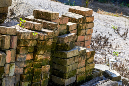Building bricks stacked outdoors in the countryside