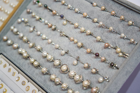 Close-up of pearl jewelry for sale in storeの写真素材