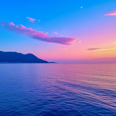 Beautiful sunset over the sea and mountains. Colorful summer landscape.の素材