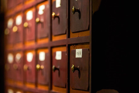 Close-up of herbal medicine cabinet in traditional Chinese medicine dispensaryの写真素材