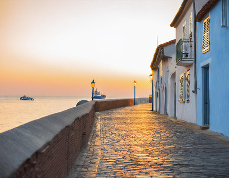 Beautiful view of the promenade along the sea at sunsetの素材