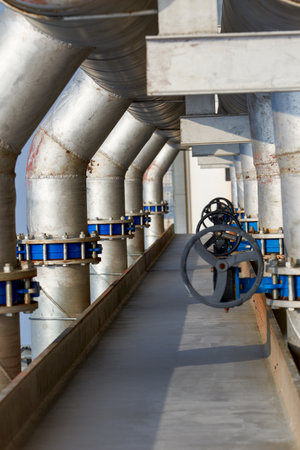 Huge industrial pipes and valves in an industrial factory
