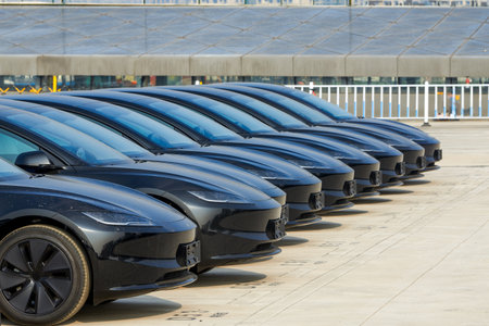 A row of brand new new energy electric cars parked in an outdoor parking lot