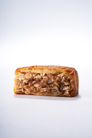 Traditional Cantonese style five-nut mooncake for Mid-Autumn Festival on white background