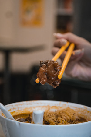 A bowl of delicious braised beef offal noodlesの写真素材