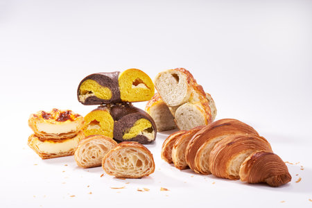 Closeup of various toasted bread combination on white backgroundの写真素材