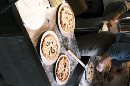 A chef is making traditional Italian pizza by handの写真素材