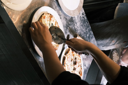 A chef is making traditional Italian pizza by handの写真素材
