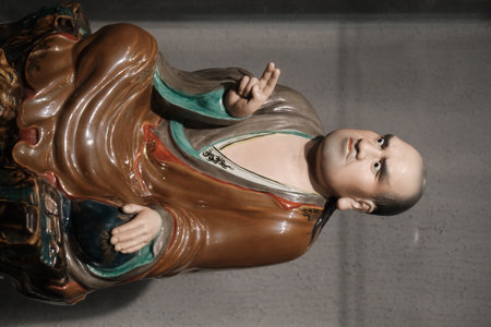 Close-up of a Buddha statue on display at the Jingdezhen Ceramics Museum in Jiangxi, China
