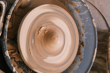 Close-up of a rotating disc used to make ceramic clayの写真素材