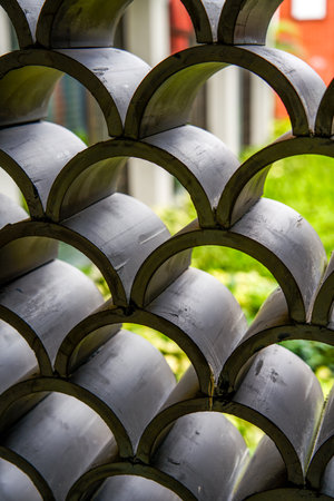 Traditional Chinese design with roof tiles and auspicious cloud patternsの写真素材
