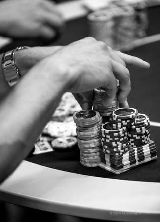 Hands during a poker gameの写真素材