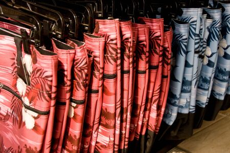 Closeup of large group of board shorts for saleの写真素材