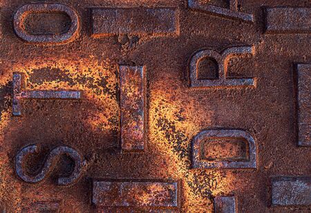 Close up of a rusted, distressed manhole utility coverの写真素材