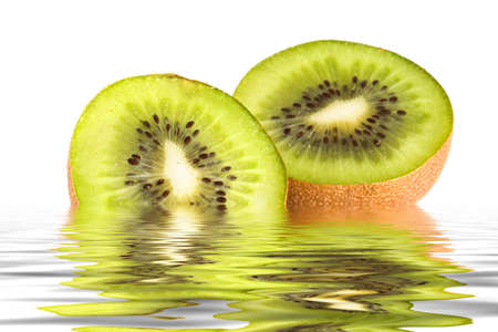Refreshing Kiwi fruit slices in rippling waterの写真素材
