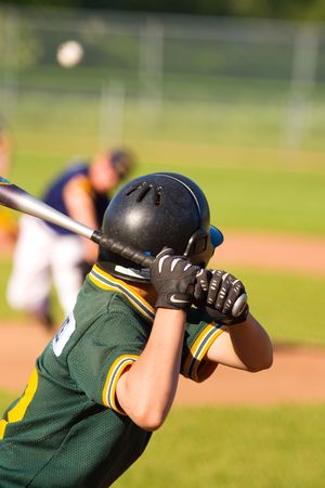 Young baseball player getting ready to hit the ballの写真素材