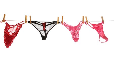 Assorted sexy  lingerie hanging on a clotheslineの写真素材